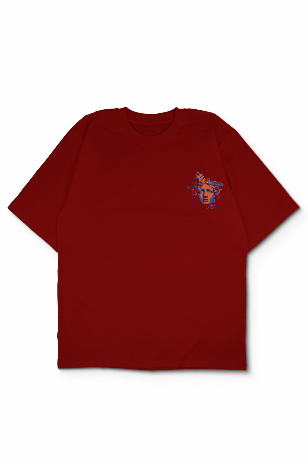 An Oversized t-shirt with a small colorful graphic on the left chest, displayed flat against a white background showing beheaded head of medusa held by perseus. Design by bakaka.